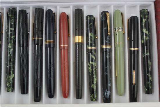 A collection of twenty Mabie Todd Swan fountain pens and a similar ejector pencil,